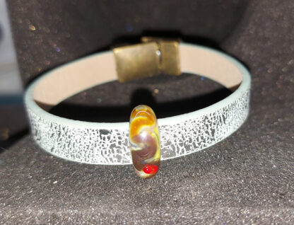 Bracelet with a magnetic clasp with a bead